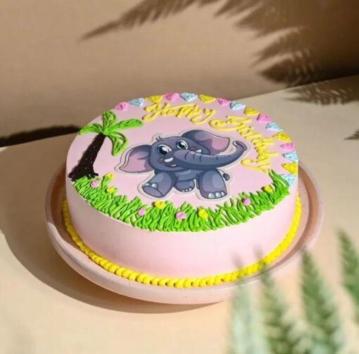 Pink baby elephant-themed cake with fondant decorations for baby girl.