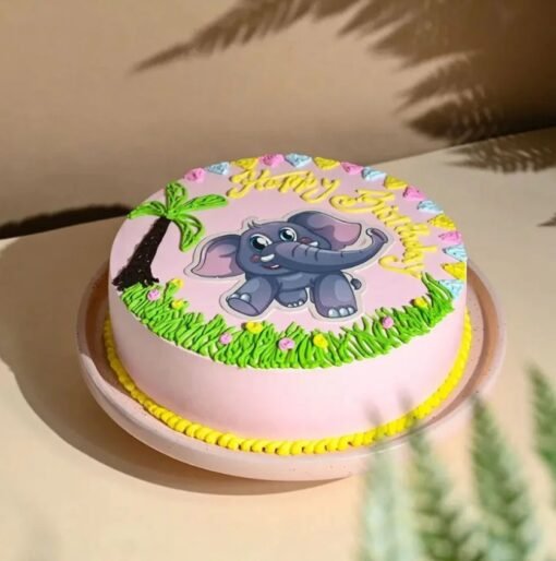Pink baby elephant-themed cake with fondant decorations for baby girl