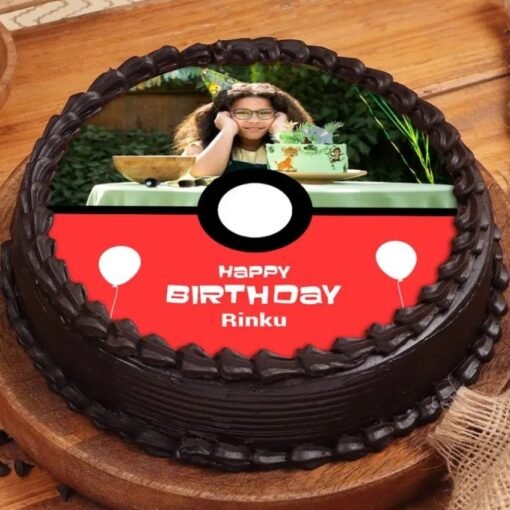 Poke Ball-themed birthday cake with custom photo for Pokémon party.