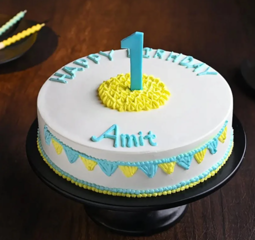 Adorable first birthday cake with number one topper and cute decorations