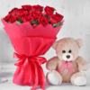 Romantic bouquet of red roses with soft teddy bear
