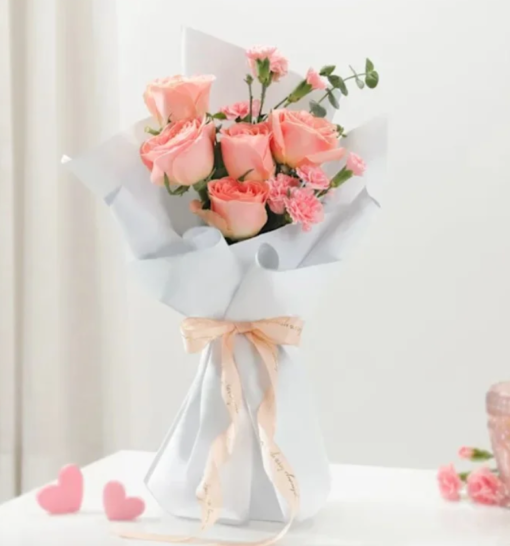 Romantic floral arrangement with red and pink roses