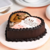 Heart-shaped cake with customized edible photo on top