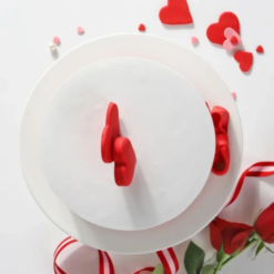 Romantic cake with heart decorations and cream frosting