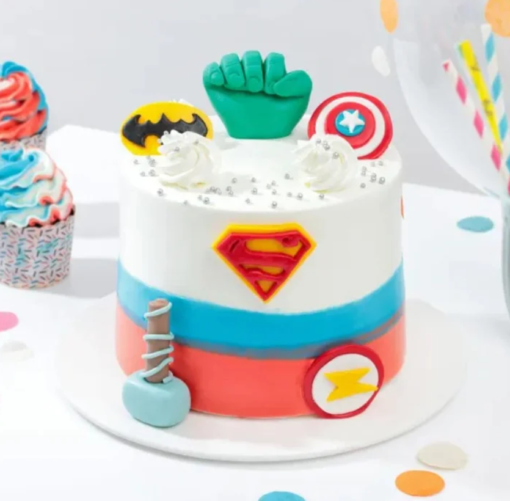 Marvel Avengers-themed cake featuring superhero toppers