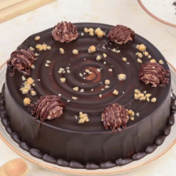 Ferrero Rocher chocolate truffle cake with hazelnut garnish