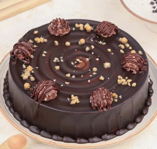 Ferrero Rocher chocolate truffle cake with hazelnut garnish