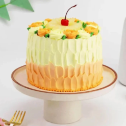 Pineapple cake with floral cream decoration and yellow accents