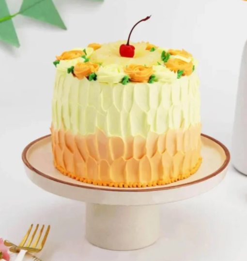 Pineapple cake with floral cream decoration and yellow accents