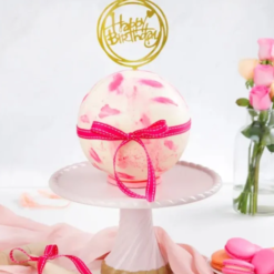 Round crystal-like pinata cake with hidden sweets inside