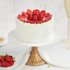 Strawberry cream cake with soft frosting and fruit topping