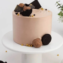 Chocolate cake with glossy frosting and festive decoration